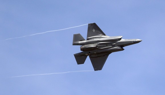 An F-35 jet arrives at its new operational base at Hill Air Force Base, in northern Utah in this Sept. 2, 2015, file photo. Shares of Lockheed Martin fell Monday, Dec. 12, 2016, as President-elect Donald Trump tweeted that making F-35 fighter planes is too costly and that he will cut "billions" in costs for military purchases. (AP Photo/Rick Bowmer, File)