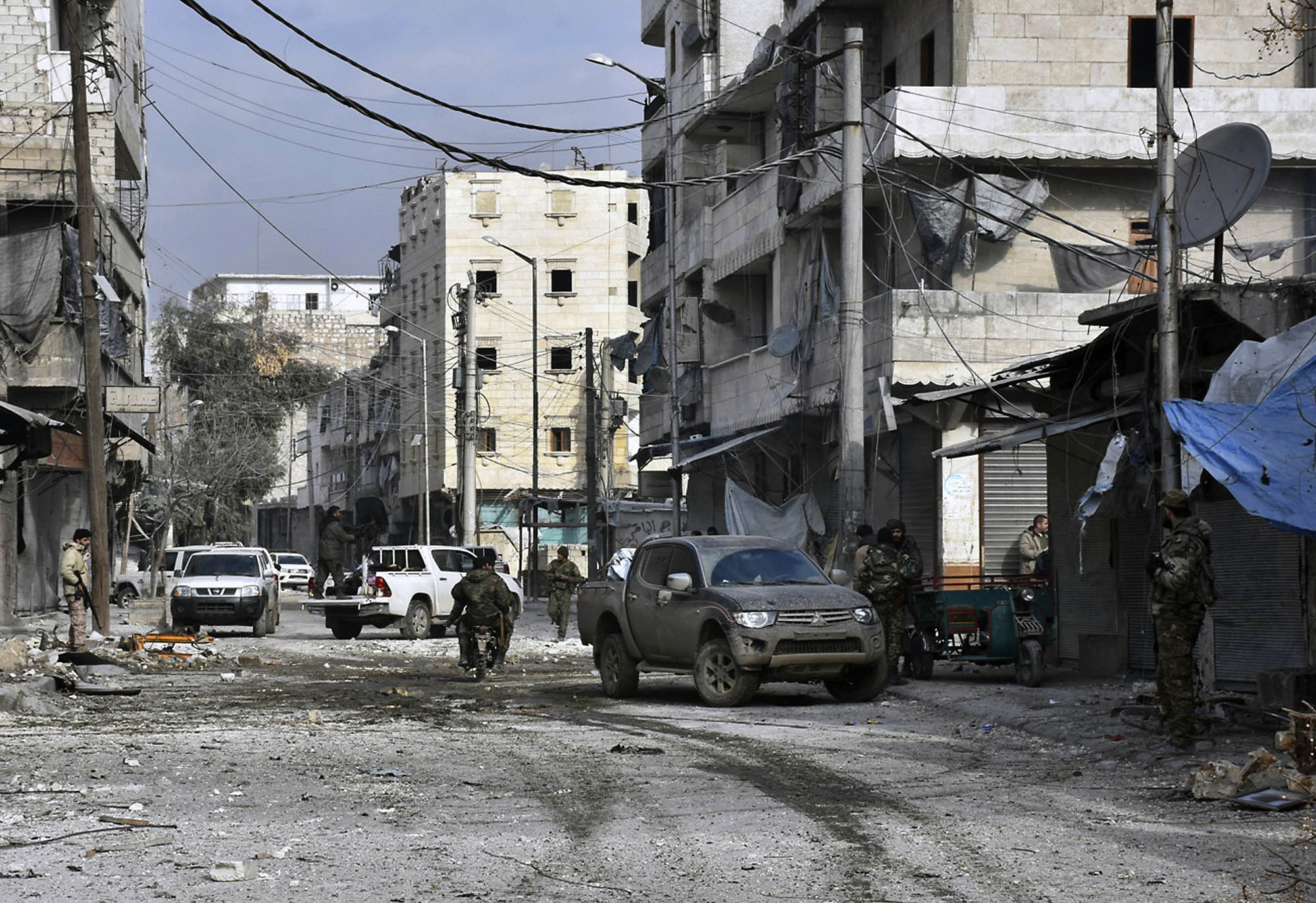 Syrian troops march through the streets of east Aleppo, Syria on Dec. 12, 2016. (SANA via AP)