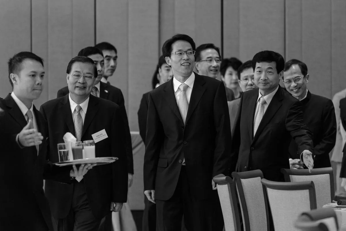 Zhang Xiaoming (C), the director of the China Liaison Office in Hong Kong, attends a luncheon with Hong Kong Legislative Council members and Beijing top officials in Hong Kong on July 16, 2013. (Philippe Lopez/AFP/Getty Images)