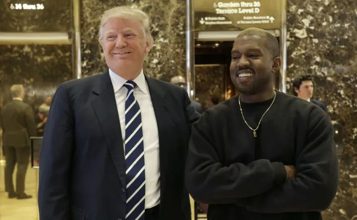 President-elect Donald Trump and Kanye West pose for a picture in the lobby of Trump Tower in New York on Dec. 13, 2016. (AP Photo/Seth Wenig)