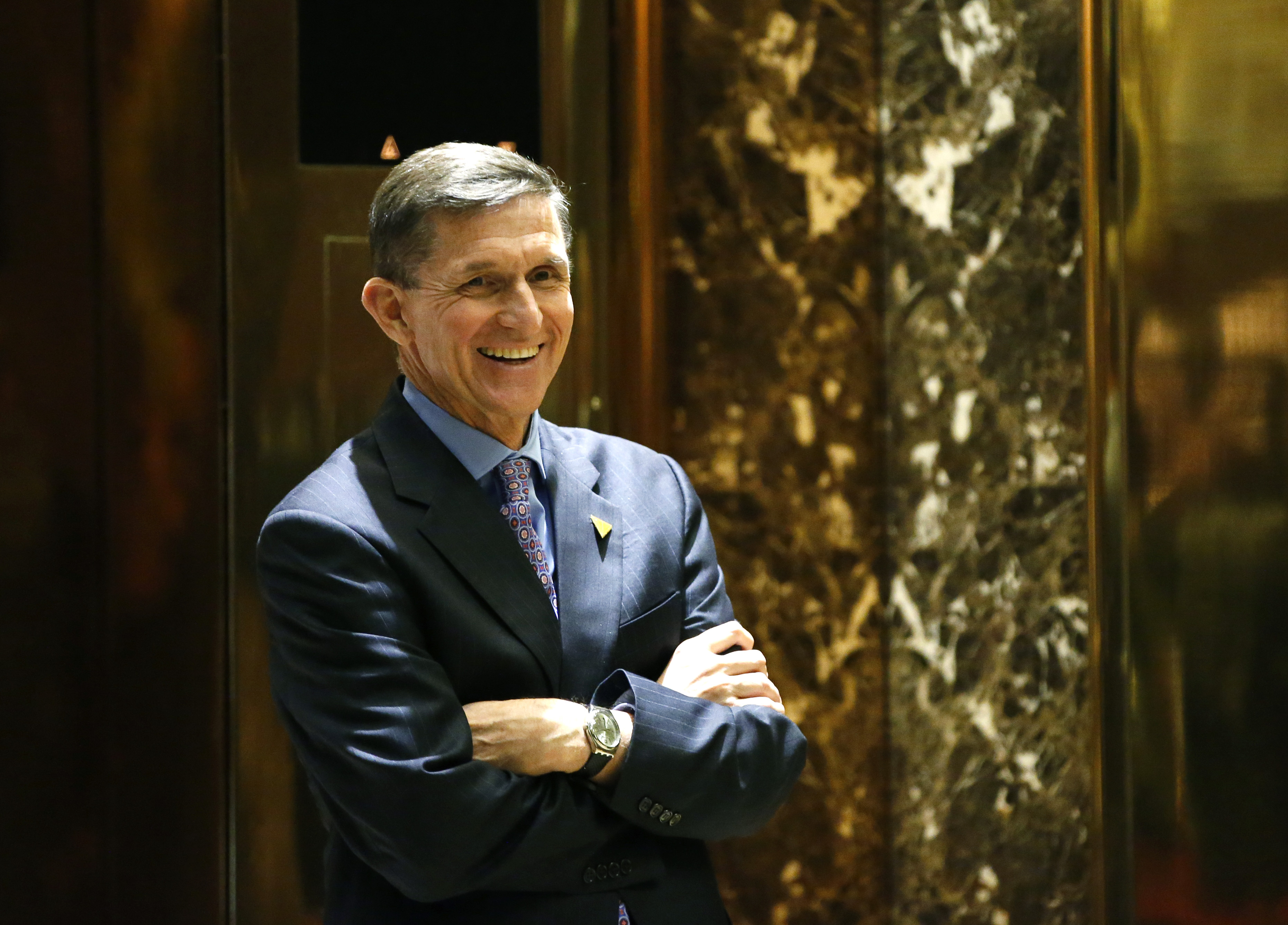 President-elect Donald J. Trump's choice for National Security Advisor, Michael T. Flynn, waits for an elevator at Trump Tower, on Dec. 12, 2016. (AP Photo/Kathy Willens)