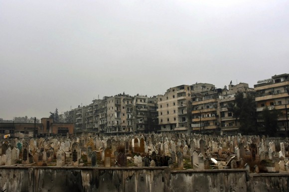 This photo released by the Syrian official news agency SANA, shows a graveyard in east Aleppo, Syria, on Dec. 13, 2016. (SANA via AP)