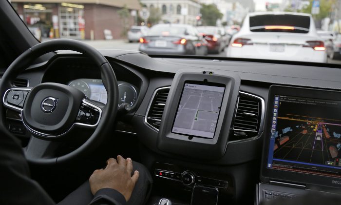 An Uber driverless car waits in traffic during a test drive in San Francisco on Dec. 13, 2016. (AP Photo/Eric Risberg)