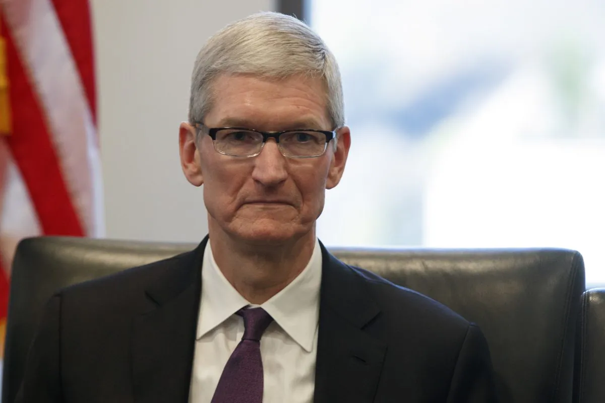 Apple CEO Tim Cook listens as President-elect Donald Trump speaks during a meeting with technology industry leaders at Trump Tower in New York, on Dec. 14, 2016. (Evan Vucci/AP Photo)