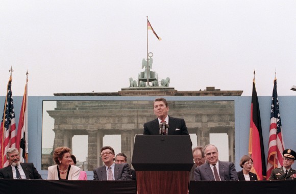 US President Ronald Reagan, commemorating the 750th anniversary of Berlin, addresses the people of West Berlin at the base of the Brandenburg Gate, near the Berlin wall on Jun. 12, 1987. Due to the amplification system being used, the President's words could also be heard on the Eastern (Communist-controlled) side of the wall. "Tear down this wall!" was the famous command from United States President Ronald Reagan to Soviet leader Mikhail Gorbachev to destroy the Berlin Wall. The address Reagan delivered that day is considered by many to have affirmed the beginning of the end of the Cold War and the fall of communism. On Nov. 9-11, 1989, the people of a free Berlin tore down that wall. (MIKE SARGENT/AFP/Getty Images)