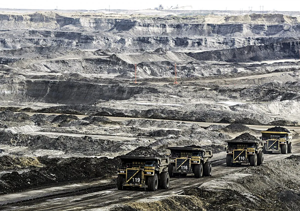 Mining trucks at the Albian Sands near Fort McMurray, Alberta, Canada, on Aug. 5, 2005. (AP Photo)