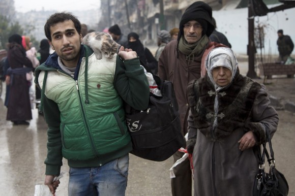 Syrians leave a rebel-held area of Aleppo towards the government-held side during an operation by Syrian government forces to retake the embattled city on Dec. 13, 2016. (KARAM AL-MASRI/AFP/Getty Images)