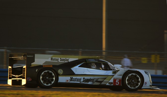 The #5 Action Express Cadillac DPi V.R. gets in a few final laps as the sun sets Tuesday, Dec. 13. (Chris Jasurek/Epoch Times)