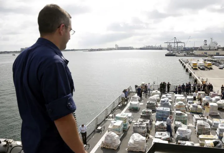 Pallets containing more than 26 tons of cocaine worth at least $715 million sit on the flight deck of of 418-foot Coast Guard Cutter Hamilton, Thursday, Dec. 15, 2016, in Fort Lauderdale, Fla. The cocaine was brought ashore Thursday following multiple recent seizures by the U.S. Coast Guard and the Royal Canadian Navy in the eastern Pacific. (AP Photo/Lynne Sladky)