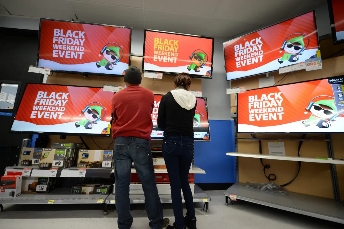 Shoppers look at televisions at a Walmart in Los Angeles (Robyn Beck/AFP/Getty Images)