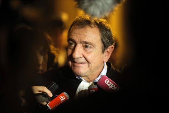 International Monetary Fund chief Christine Lagarde's lawyer, Patrick Maisonneuve, addresses media outside a special Paris court in France on Dec. 19, 2016. French court found IMF chief Christine Lagarde guilty in arbitration case, but she escaped punishment. (AP Photo/Michel Euler)