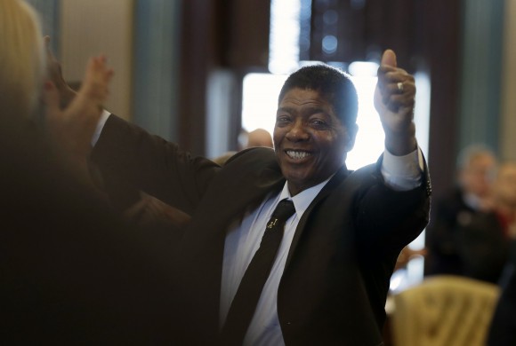 Electoral College elector Henry Hatter reacts after Gov. Rick Snyder announced all 16 votes for President-elect Donald Trump in Lansing, Mich. on Dec. 19, 2016. (AP Photo/Carlos Osorio)