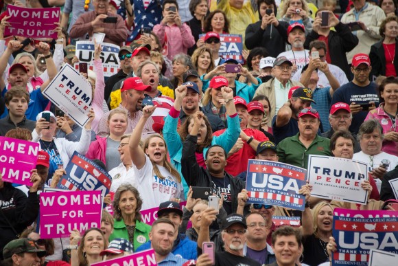 Supporters cheers as US President-elect Donald Trump speaks in Mobile, Alabama, during a 'Thank You Tour 2016' rally on Dec. 17, 2016. (JIM WATSON/AFP/Getty Images)