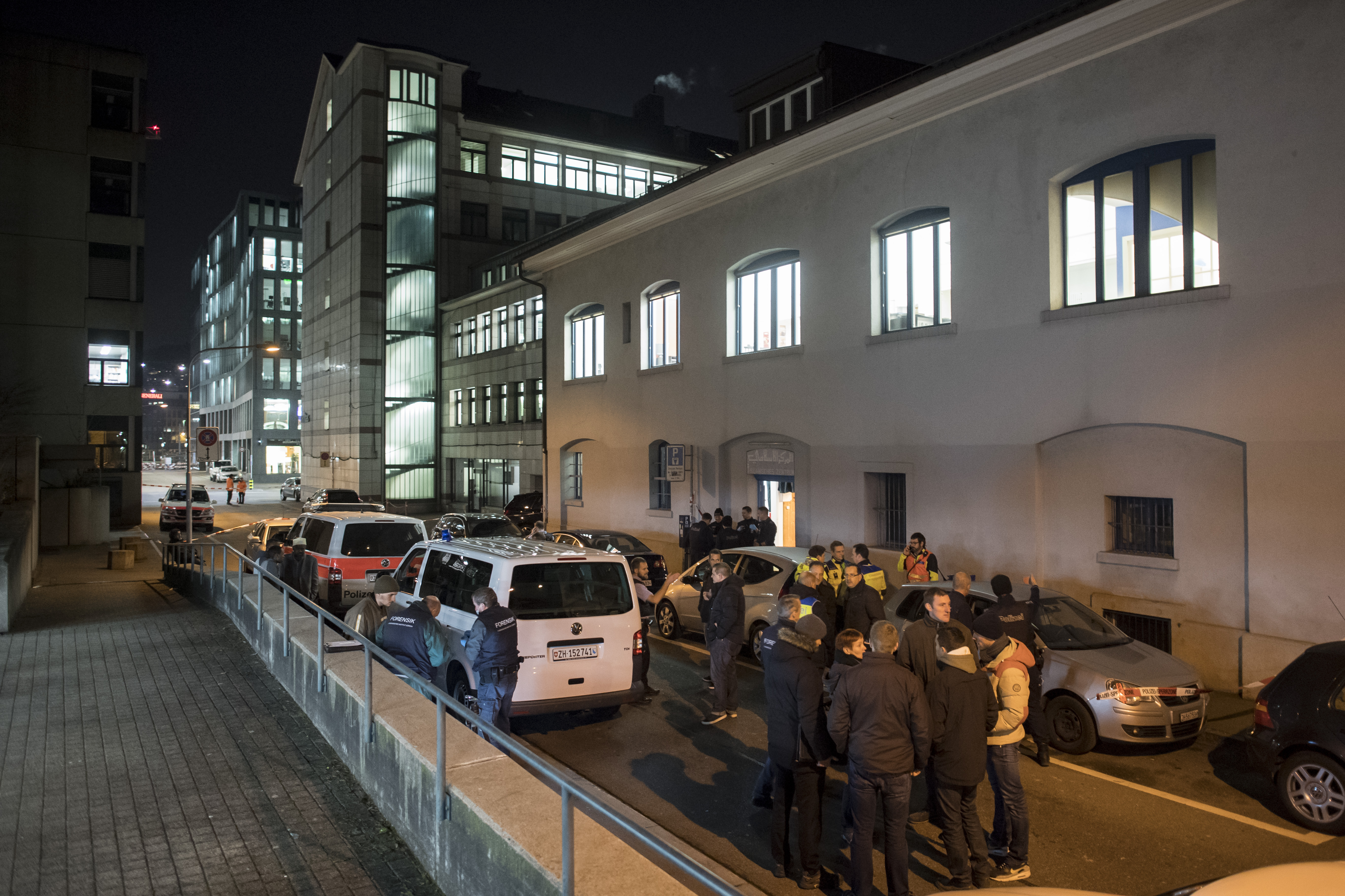 Police cars are parked in front of the Islamic center, in Zurich, on Dec. 19, 2016. (Ennio Leanza/Keystone via AP)