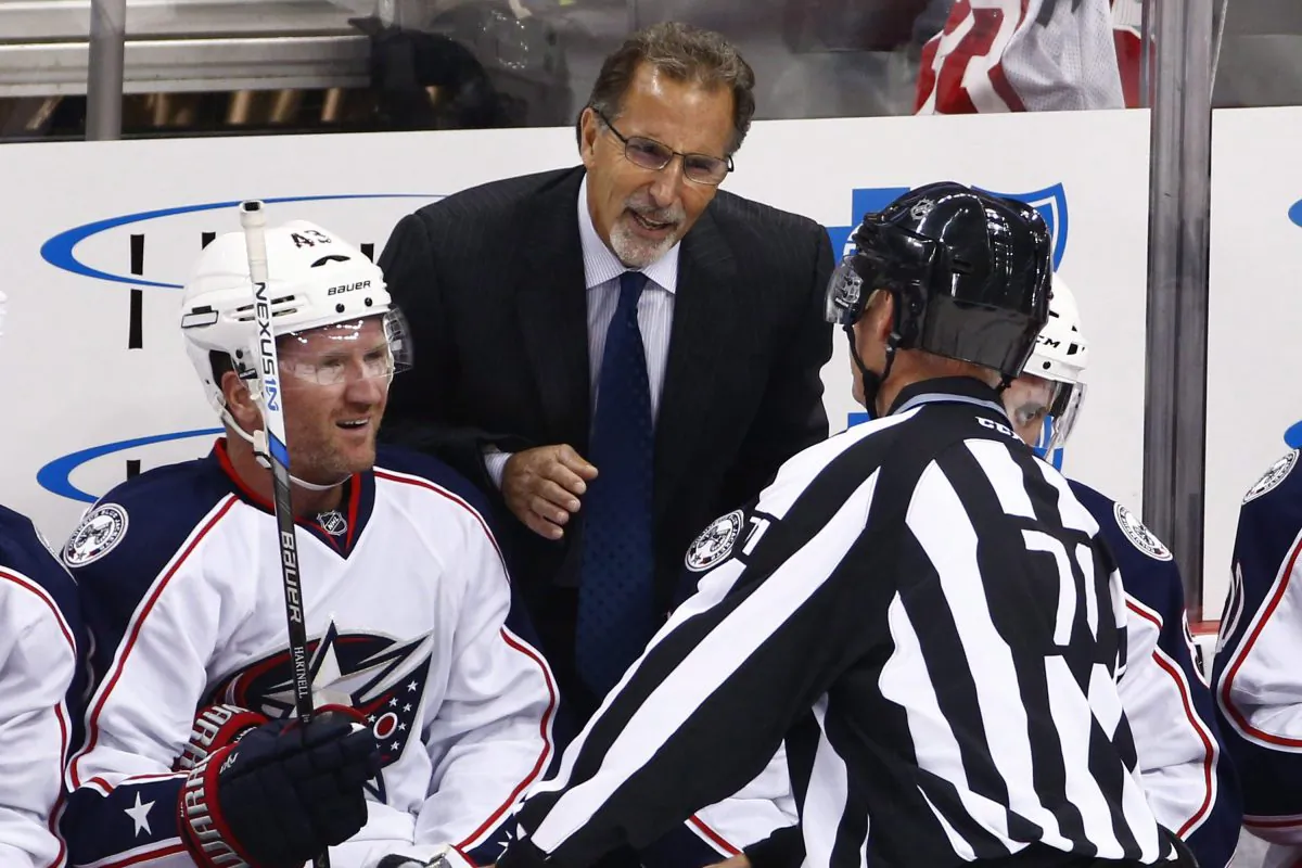 Columbus Blue Jackets head coach John Tortorella talks with linesman Brad Kovachik as Scott Hartnell reacts in a game in Pittsburgh on Oct. 8. The Blue Jackets have the fewest regulation-time losses in the NHL. (AP Photo/Gene J. Puskar)