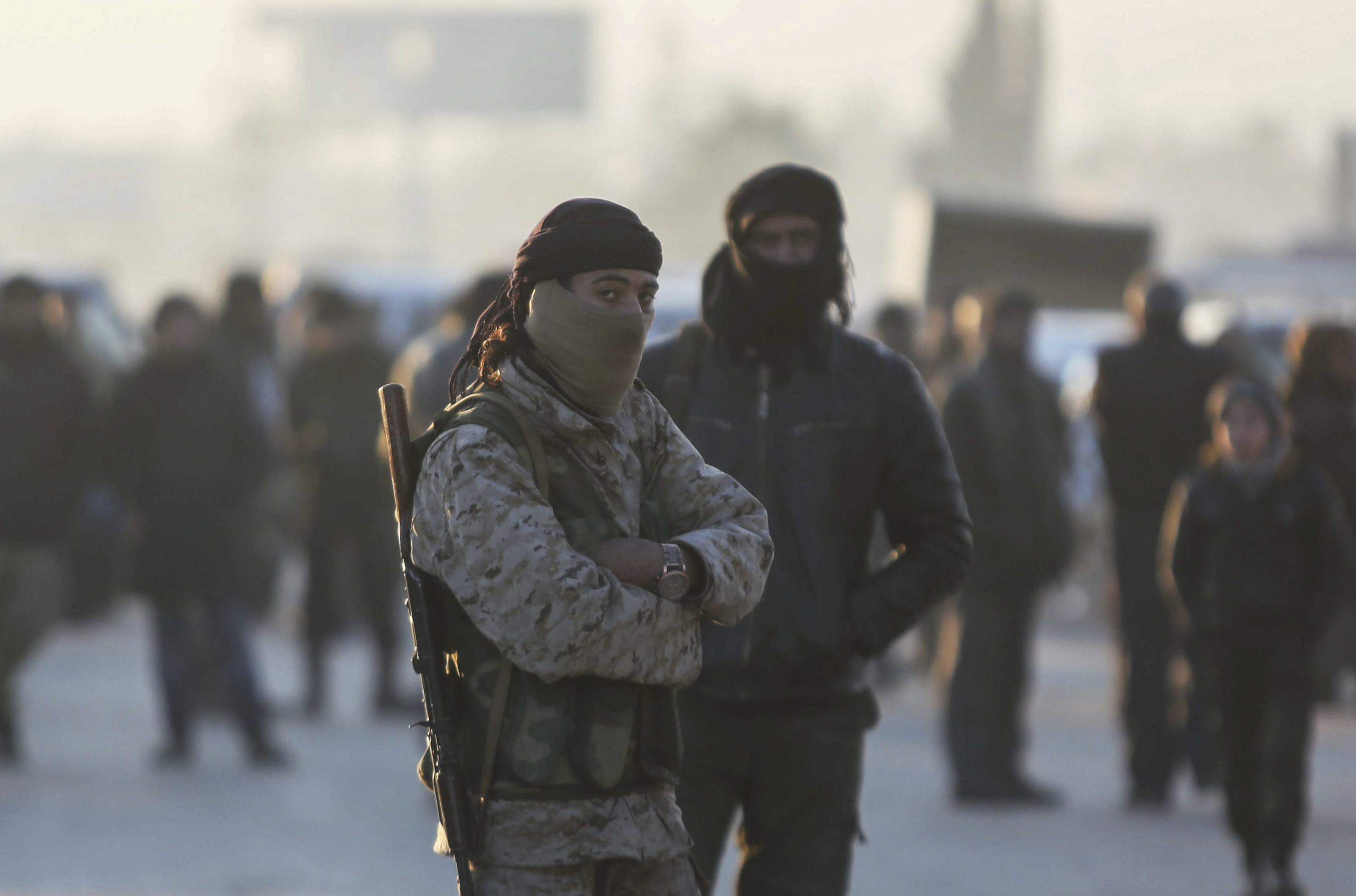 Armed Syrian fighters evacuated from the embattled Syrian city of Aleppo during the ceasefire arrive at a refugee camp in Rashidin, near Idlib, Syria, on Dec. 20, 2016. (AP Photo)