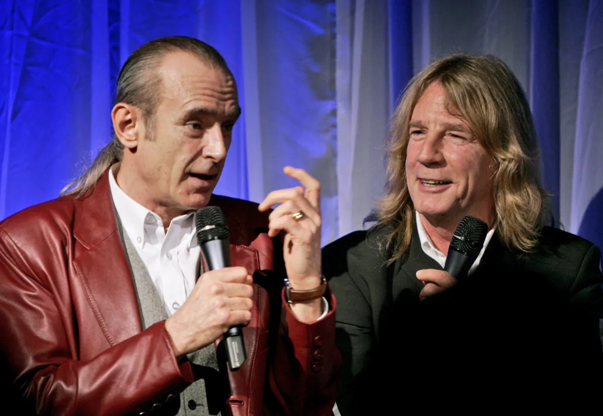 FILE - In this file photo dated Wednesday Oct. 26, 2005, showing members of Status Quo, with Francis Rossi, left, and Rick Parfitt during the launch of a DVD to mark the 40th anniversary of the rock band in London. (AP Photo/Matt Dunham, FILE)