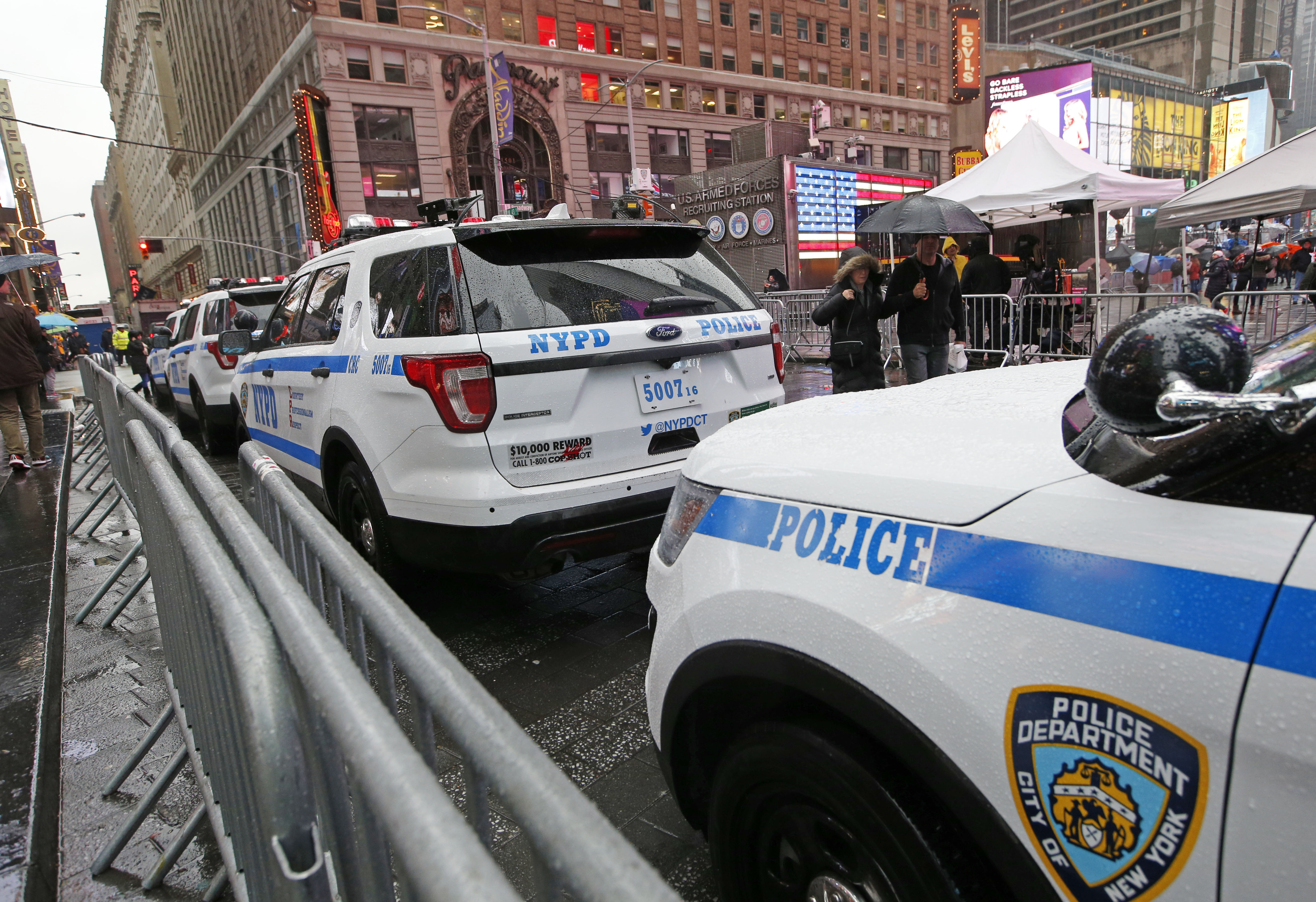 A line of police cars are parked along a street in Times Square, on Dec. 29, 2016. (AP Photo/Kathy Willens)