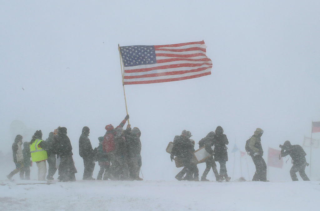 Despite blizzard conditions, military veterans march in support of the "water protectors" at Oceti Sakowin Camp on the edge of the Standing Rock Sioux Reservation on December 5, 2016 outside Cannon Ball, North Dakota. (Scott Olson/Getty Images)