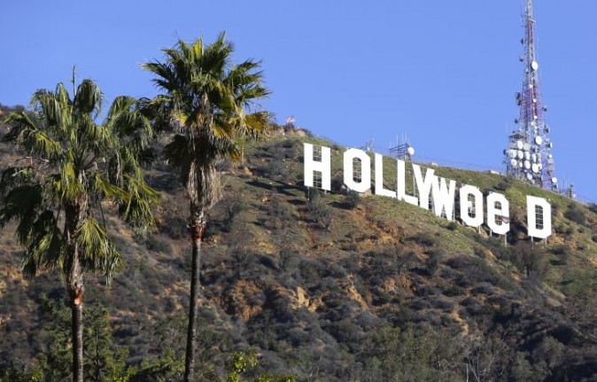 The Hollywood sign is seen vandalized Sunday, Jan. 1, 2017. Los Angeles residents awoke New Year's Day to find a prankster had altered the famed Hollywood sign to read "HOLLYWeeD." Police have also notified the city's Department of General Services, whose officers patrol Griffith Park and the area of the rugged Hollywood Hills near the sign. California voters in November approved Proposition 64, which legalized the recreational use of marijuana, beginning in 2018. (AP Photo/Damian Dovarganes)