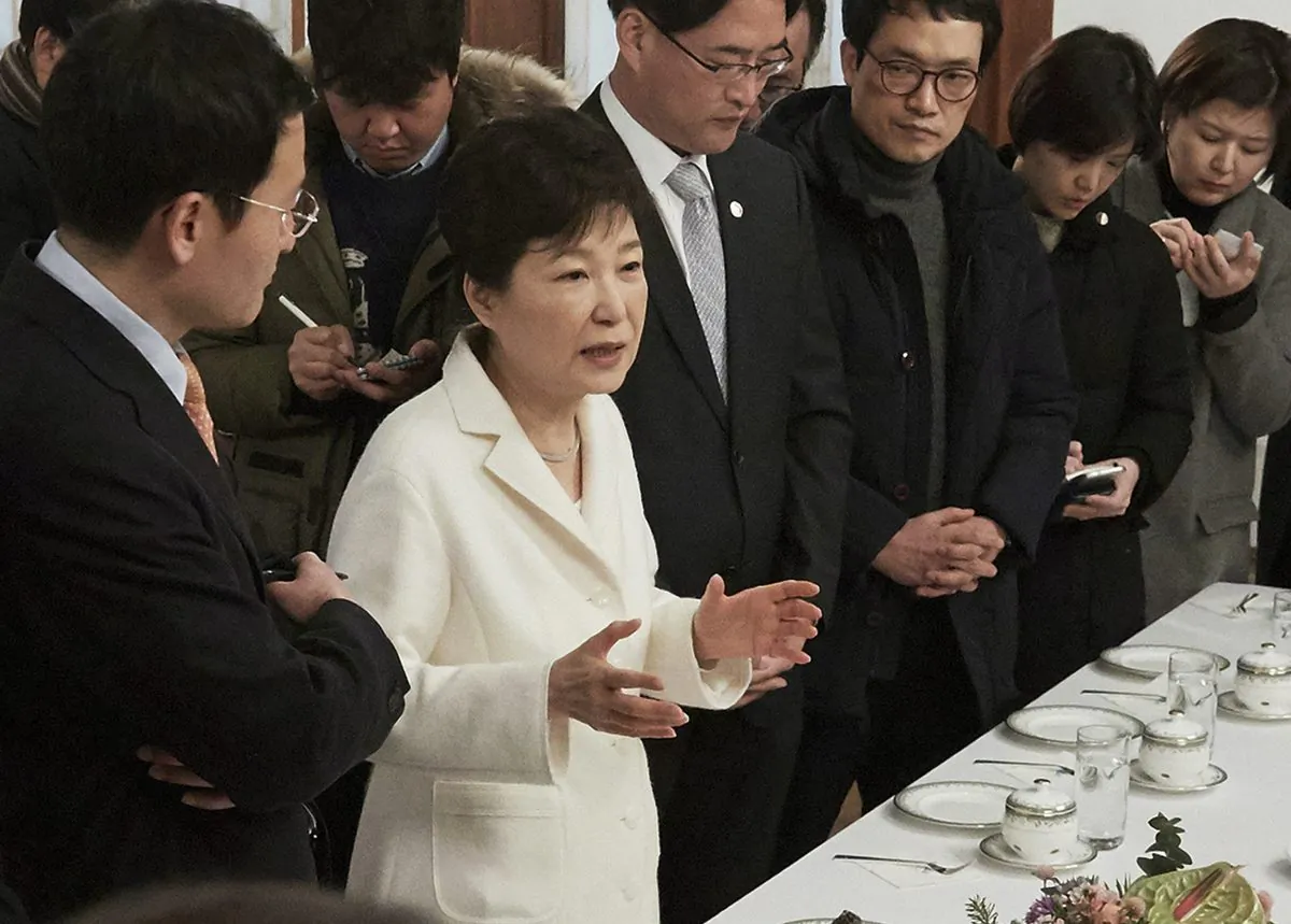 impeached South Korean President Park Geun-hye, second from left, during a meeting with a selected group of reporters at the presidential house in Seoul on Jan. 3, 2016. (The South Korean Presidential House via AP, File)