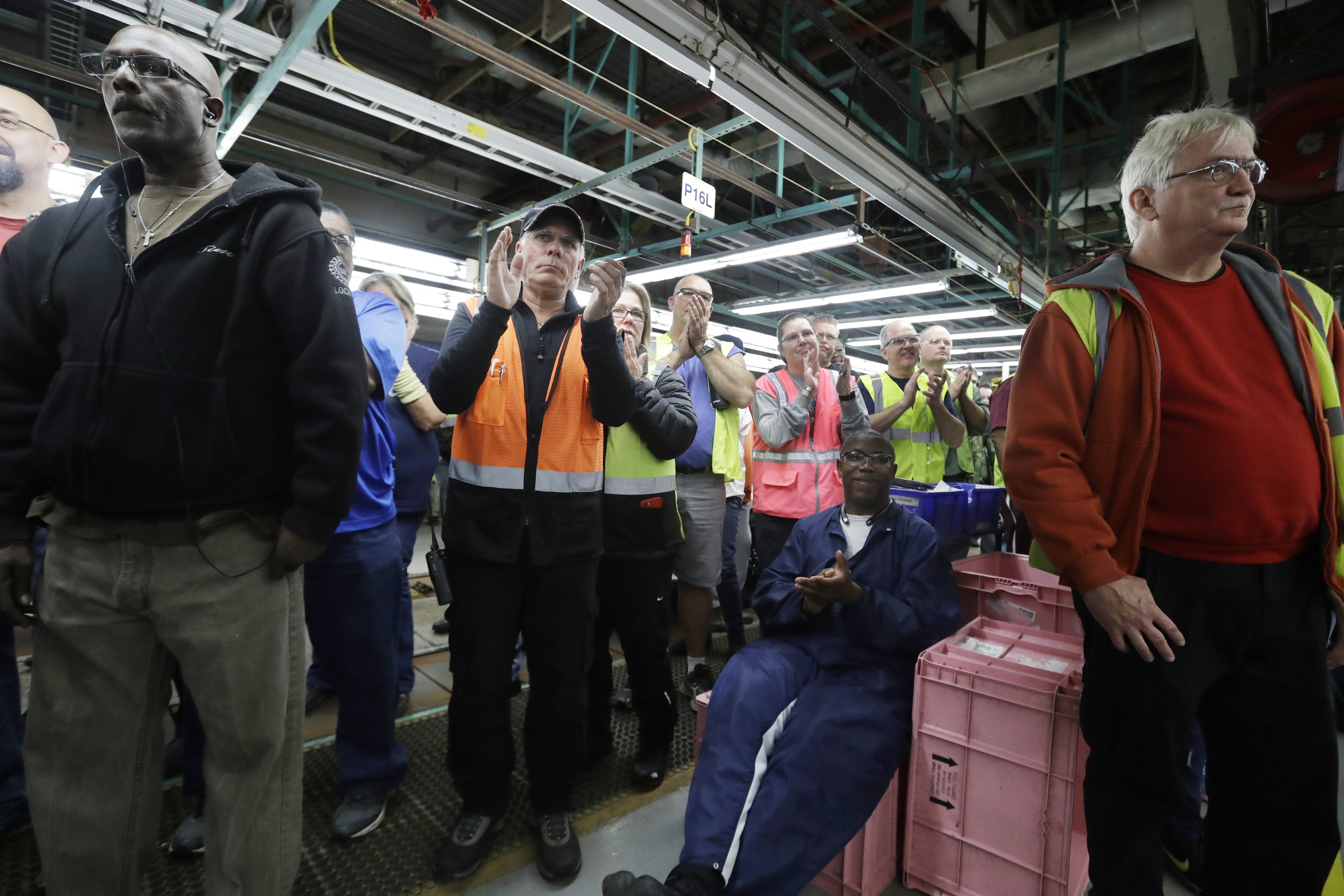 Flat Rock Assembly employees clap as Ford President and CEO Mark Fields addresses the auto plant in Flat Rock, Mich., on Jan. 3, 2017. (AP Photo/Carlos Osorio)