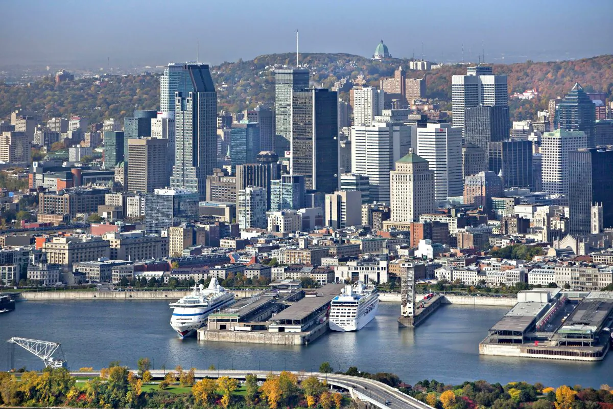 Montreal skyline and the St. Lawrence River. The city is celebrating its 375th anniversary with a plethora of events throughout the year. (Tourisme Montréal, Stéphan Poulin)