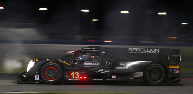 Nick Heidfeld takes a turn behind the wheel of the #13 Rebellion Oreca-Gibson, piercing a cloud of tire smoke during night practice at the 2017 Roar Before the Rolex 24. (Chris Jasurek/Epoch Times)