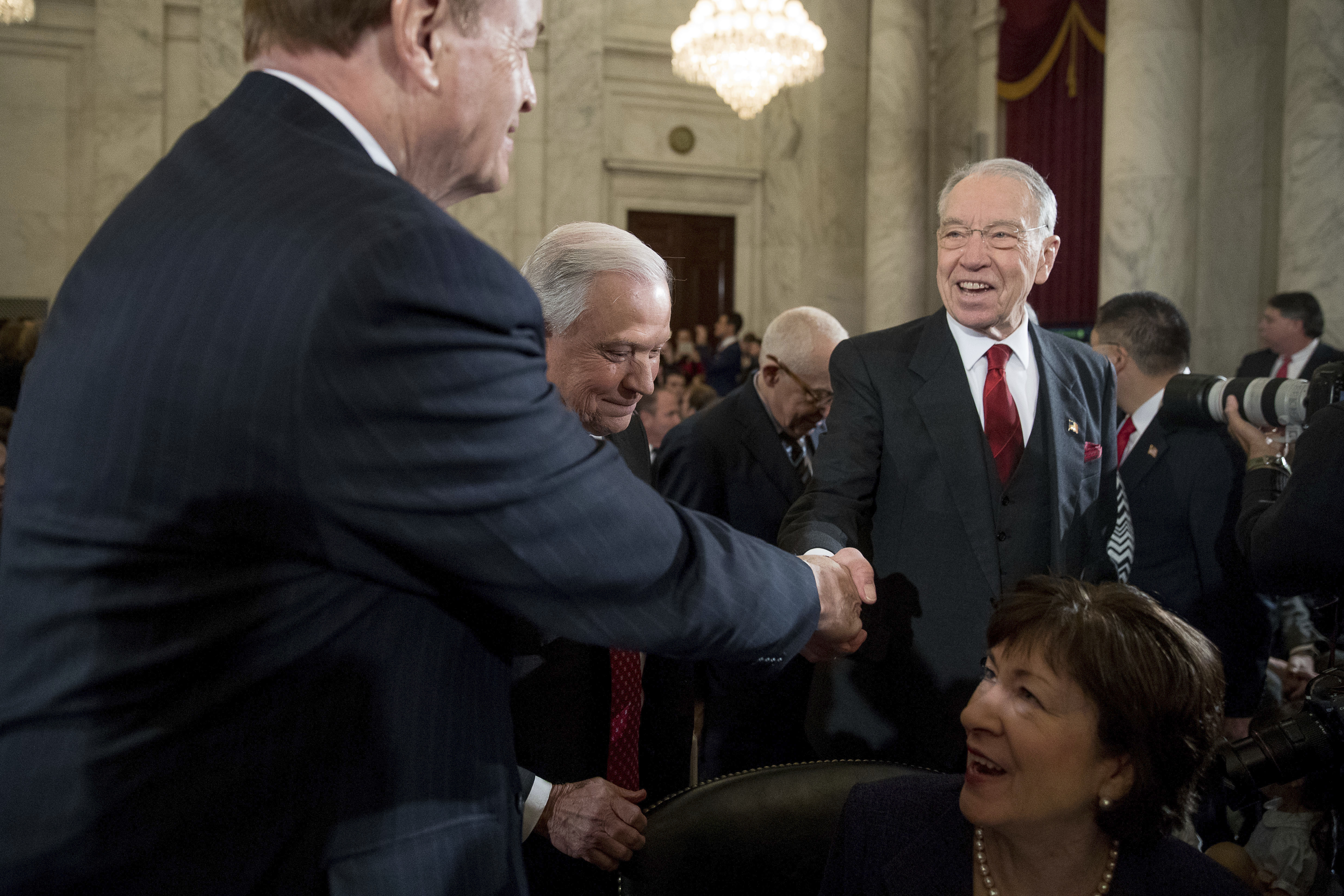 Senate Judiciary Committee Chairman Sen. Charles Grassley, R-Iowa (R) accompanied by Attorney General-designate, Sen. Jeff Sessions, R-Ala. (C) greets Sen. Richard Shelby, R-Ala. (L) and Sen. Susan Collins, R-Maine (Bottom R) on Capitol Hill in Washington on Jan. 10, 2017. (AP Photo/Andrew Harnik)