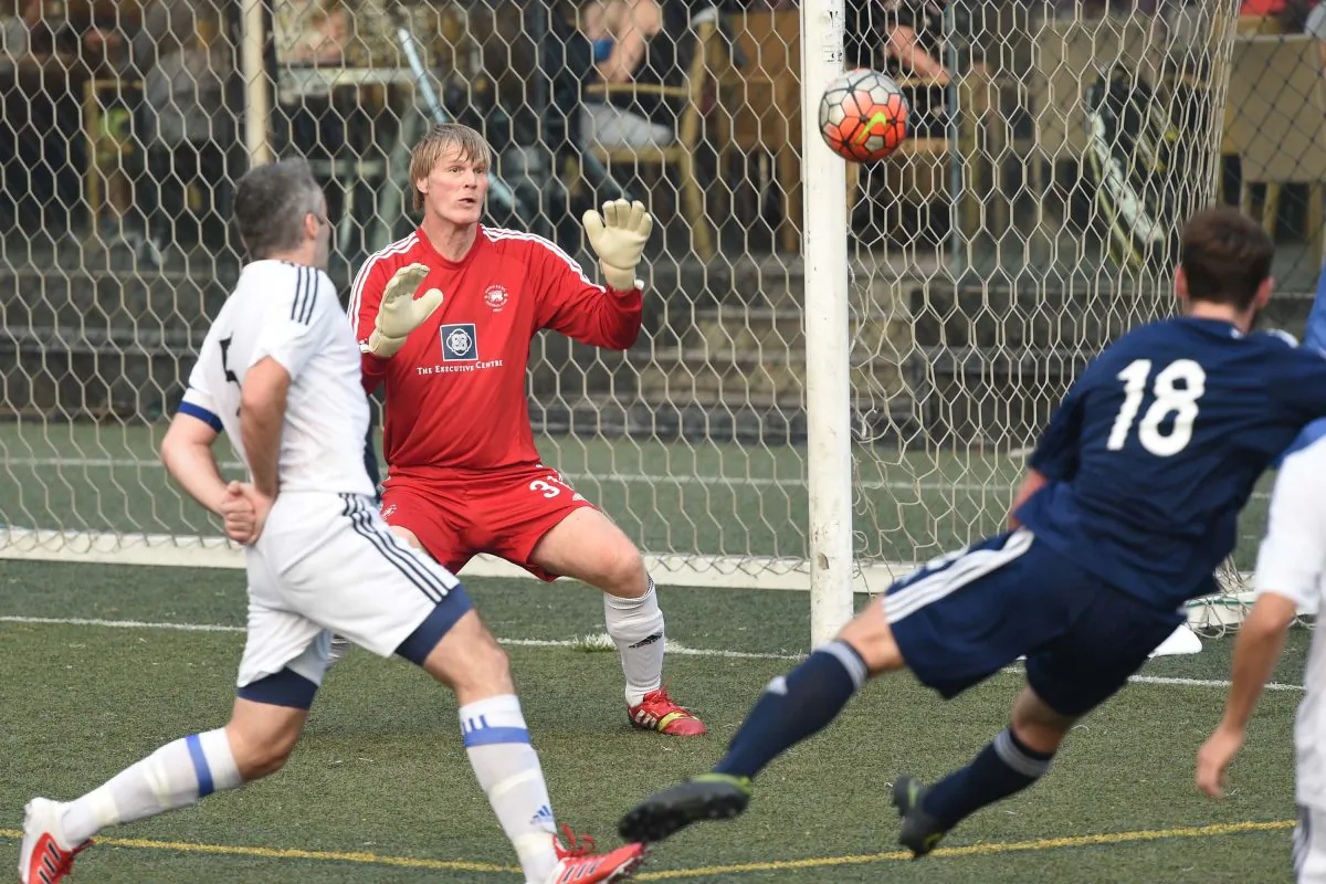 Albion goalie, Rudy Hollaender carefully watches this ball goal attempt by Wanderers in the Derby match at Sports Road on Sunday Jan 8, 2017. (Bill Cox/Epoch Times)