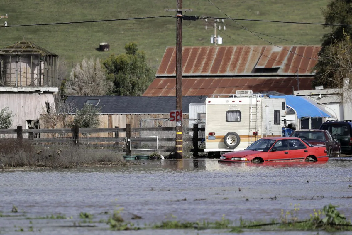 Floodwaters surround a property in Hollister, Calif., on Jan. 11, 2017. (Marcio Jose Sanchez/AP Photo)