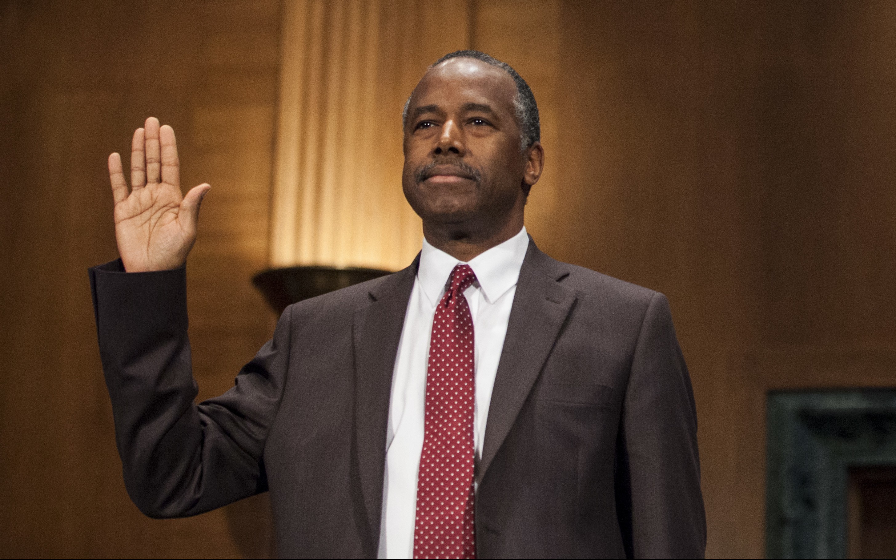 Housing and Urban Development Secretary-designate Ben Carson is sworn in on Capitol Hill in Washington on Jan. 12, 2017. (AP Photo/Zach Gibson)