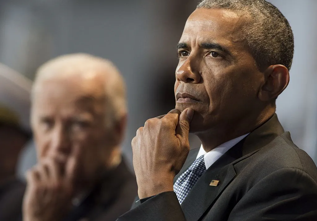 Then-President Barack Obama sits alongside then-Vice President Joe Biden at Joint Base Myers-Henderson Hall in Arlington, VA, on Jan. 4, 2017. (SAUL LOEB/AFP/Getty Images)