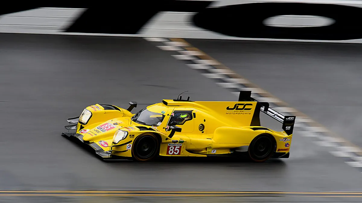 The #85 JDC-Miller Motorsports Oreca-Gibson crosses the finish line at Daytona International Speedway during the rainy Saturday morning session of the 2017 IMSA WeatherTech Roar Before the Rolex 24, Jan. 7, 2017. (Bill Kent/Epoch Times)