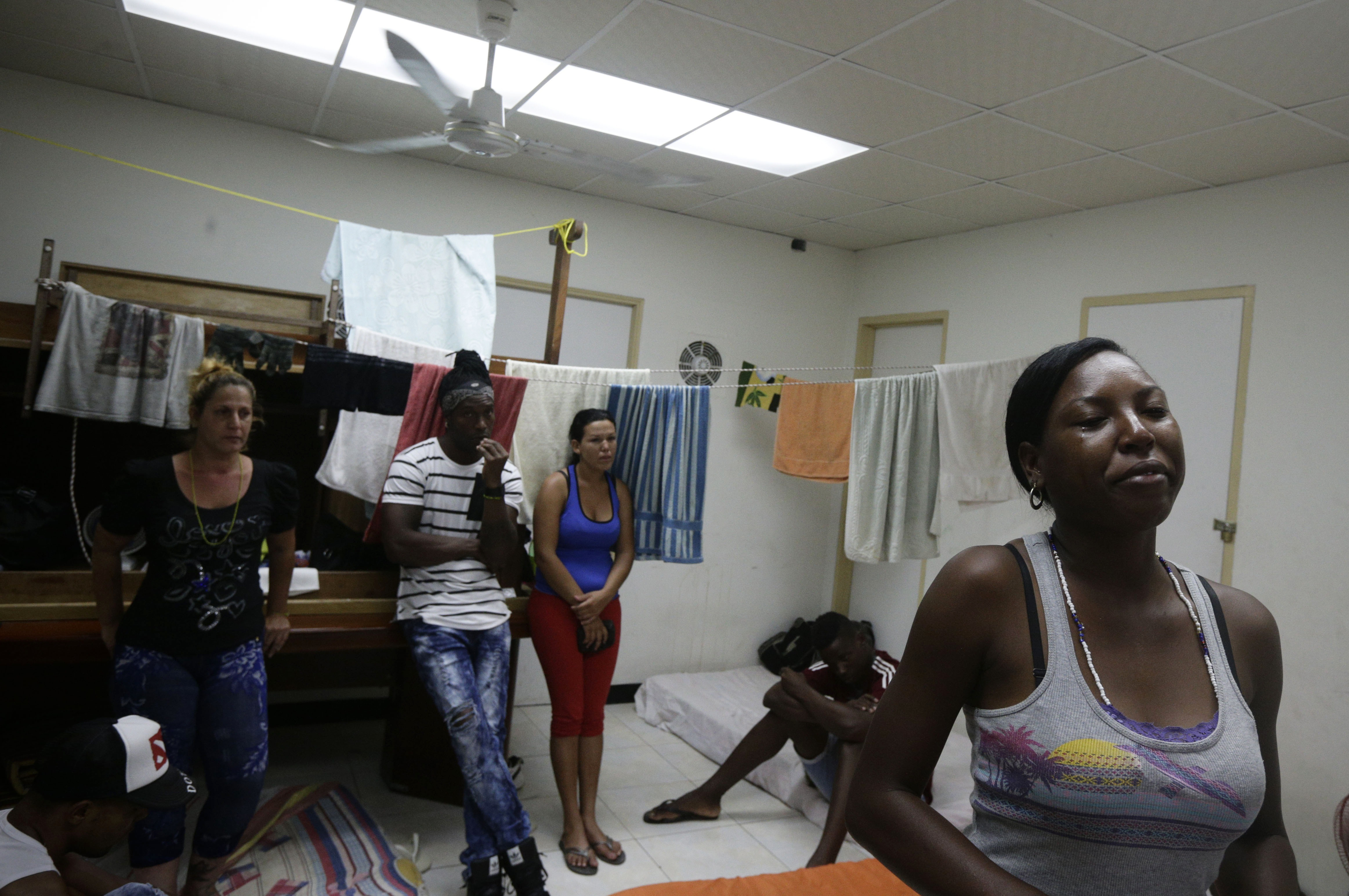Cuban migrant Yarisel Isac Wilson, 20 (R) cries as she talks about her journey to the U.S. at a migrant shelter in Panama City on Jan. 12, 2017. (AP Photo/Arnulfo Franco)