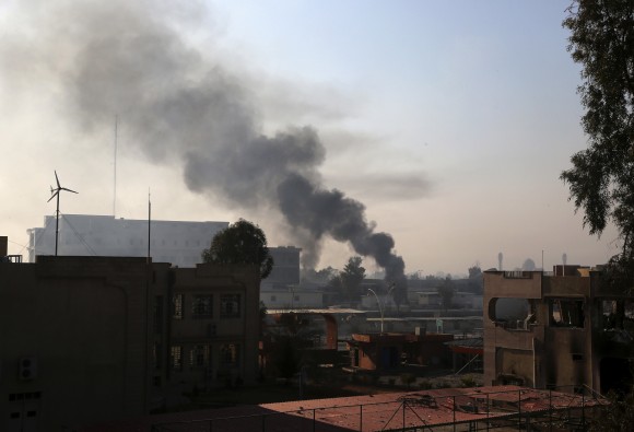 Smoke rises as Iraqi security forces fight against Islamic State militants inside Mosul University, in the eastern side of Mosul, Iraq on Jan. 14, 2017. (AP Photo/ Khalid Mohammed)