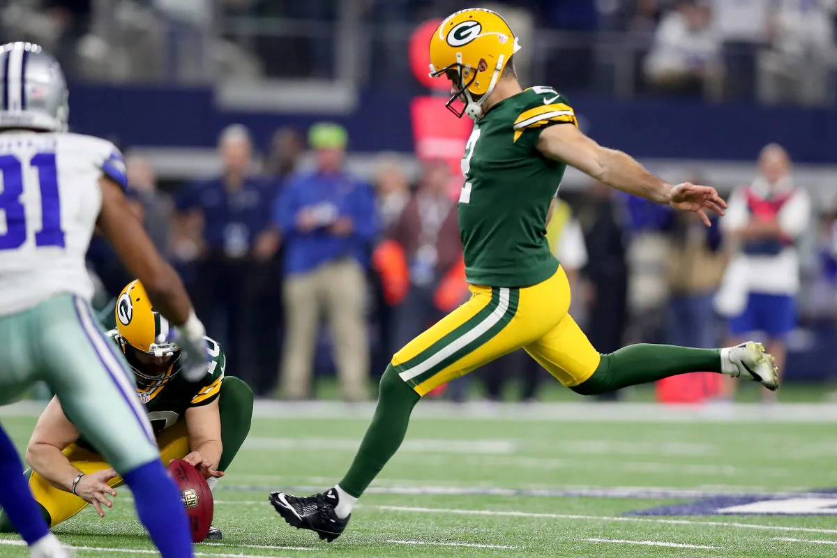 Mason Crosby of the Green Bay Packers kicks the game-winning field goal against the Dallas Cowboys at AT&T Stadium on Jan. 15, 2017 in Arlington, Texas. The game featured four 50-yard field goals. (Tom Pennington/Getty Images)