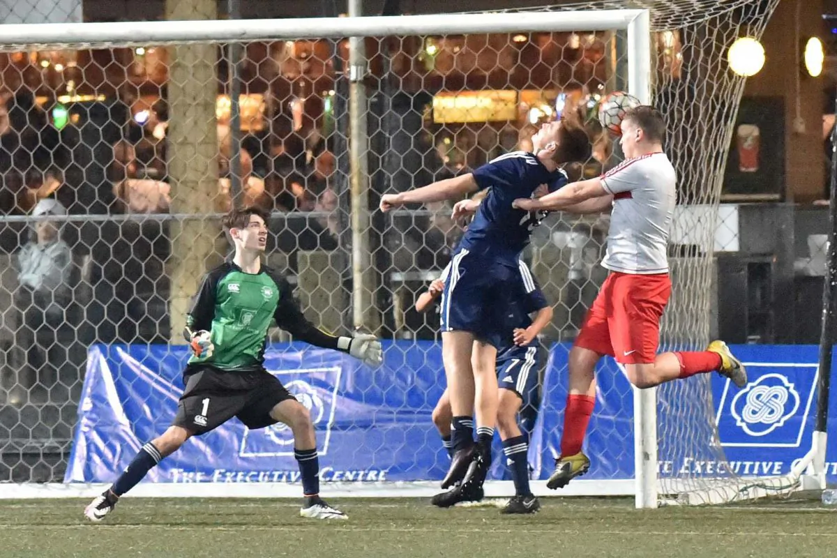 Fortunate escape for Colts from this Hearts corner as the Hearts attacker just mistimes contact with the ball. Colts in their Yau Yee League Cup game at Sports Road on Sunday Jan 15, 2017. Colts went on to win the match to progress to round 2. (Bill Cox/Epoch Times)