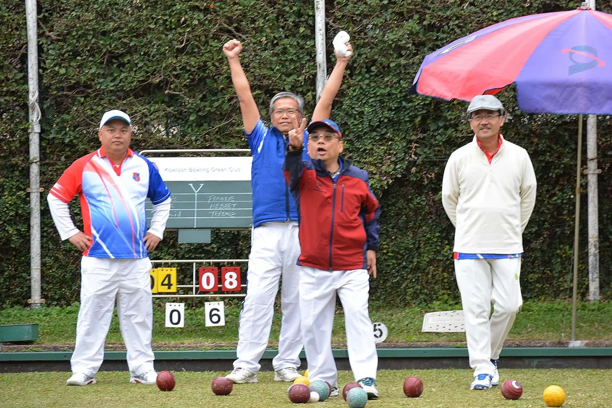 At KBGC on Saturday Jan 14, Frankie Siu and Herbert Kwok of HKFC-A cheer as their skip Terrence Lee (not in photo) wins the end with a score of 2 against KBGC-A. HKFC-A won the game 6/2 to take them into 3rd place in the table only 1 point behind HKFC-B and 5 points behind leaders CCC-A. (Stephanie Worth)