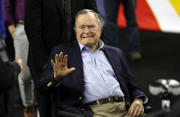 In this April 2, 2016, file photo, former President George H. W. Bush waves as he arrives at NRG Stadium before the NCAA Final Four tournament college basketball semifinal game between Villanova and Oklahoma in Houston. Houston-area media are quoting former President George H.W. Bush's chief of staff as saying that Bush has been hospitalized in Houston. (AP Photo/David J. Phillip, File)