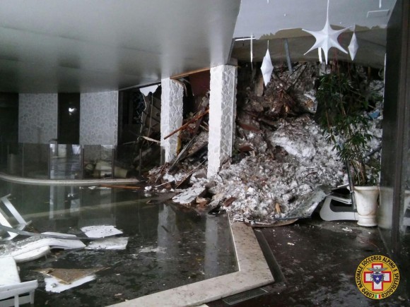 The interior of the Rigopiano Hotel is destroyed by an avalanche in Farindola, Italy, early Thursday, Jan. 19, 2017. Rescue workers on skis reached a four-star spa hotel buried by an avalanche in earthquake-stricken central Italy Thursday, reporting no signs of life as they searched for around 30 people believed trapped inside. (Corpo Nazionale Soccorso Alpino e Speleologico/The National Alpine Cliff and Cave Rescue Corps (CNSAS) via AP)