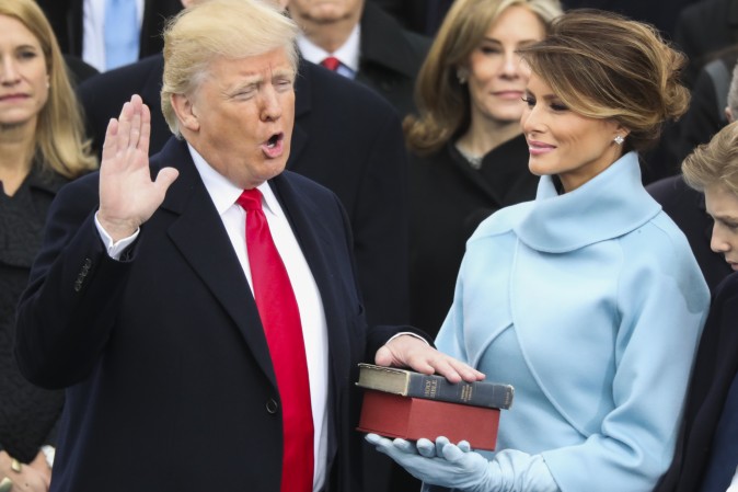 Donald Trump is sworn in as the 45th president of the United States as Melania Trump looks on during the 58th Presidential Inauguration at the U.S. Capitol in Washington, Friday, Jan. 20, 2017. (AP Photo/Andrew Harnik)