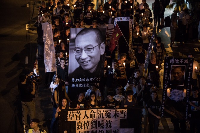 People attend a candlelight march for the late Chinese Nobel laureate Liu Xiaobo in Hong Kong on July 15, 2017. Liu died on July 13 after a battle with cancer, remaining in custody until the end, making him the first Nobel Peace Prize laureate to die in state custody since German pacifist Carl von Ossietzky in 1938. (DALE DE LA REY/AFP/Getty Images)