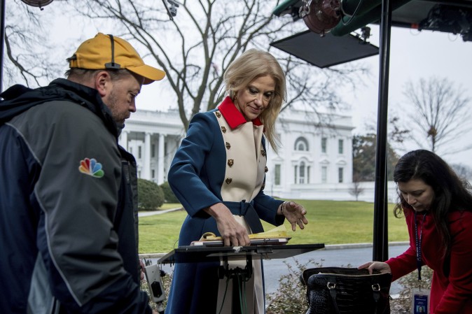 President Donald Trump's adviser Kellyanne Conway gets ready to go on television outside the White House, Sunday, Jan. 22, 2017, in Washington. (AP Photo/Manuel Balce Ceneta)