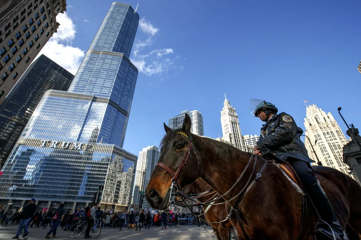 Police keep an eye on protesters outside of Trump Tower on Jan. 21, 2017 in Chicago, Illinois. Tens of thousands of demonstrators took to the streets in protest after the inauguration of President Donald Trump. (John Gress/Getty Images)
