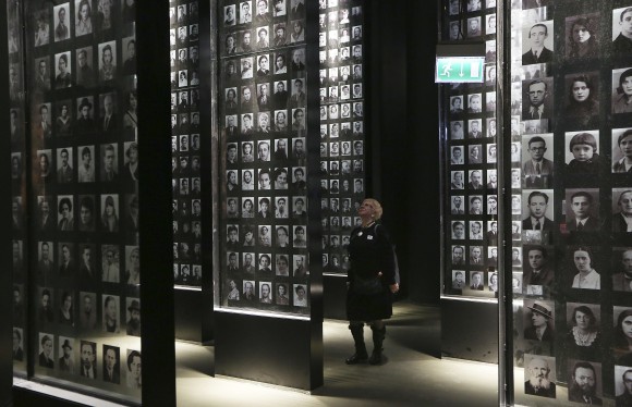A visitor looks at an exhibit in the Museum of the Second World War, an ambitious new museum under creation for nine years has opened its doors for a day to historians, museums and reporters in Gdansk, Poland, on Jan. 23, 2017. (AP Photo/Czarek Sokolowski)