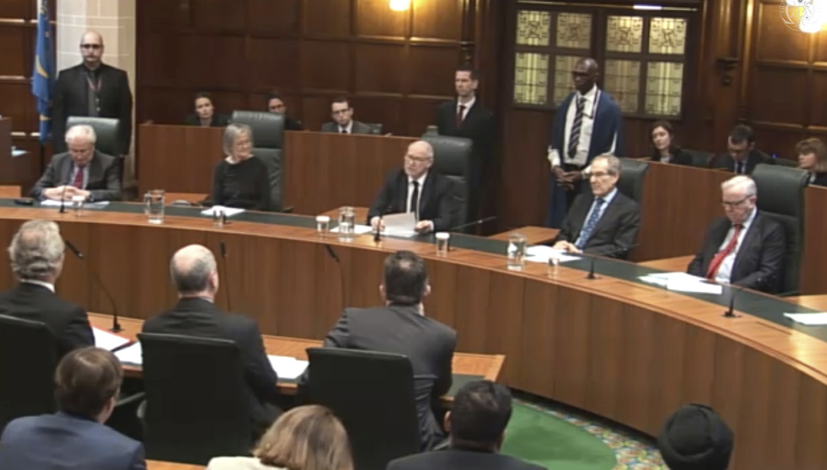 Lord Neuberger, President of the Supreme Court, center, speaks at Britain's Supreme Court in London on Jan. 24, 2017. (Supreme Court via AP)