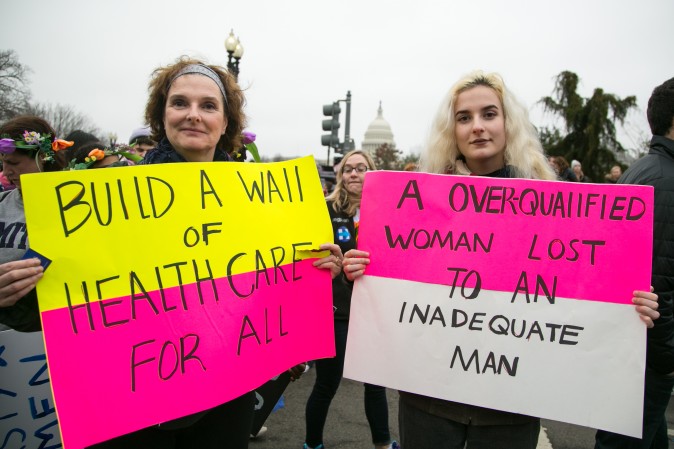 Bailey Beeken with her daughter Quinn Wilke, from New York, at the Woman's March on Washington on Jan. 21. (Benjamin Chasteen/Epoch Times)