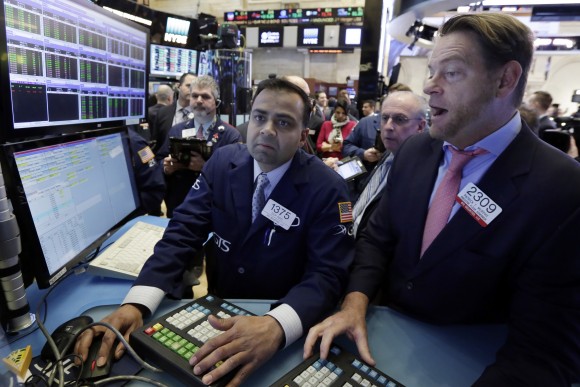 Specialists Dilip Patel, left, and Patrick Murphy work on the floor of the New York Stock Exchange on Jan. 25, 2017. The market has been marching steadily higher since bottoming out in March 2009 in the aftermath of the financial crisis. (AP Photo/Richard Drew)