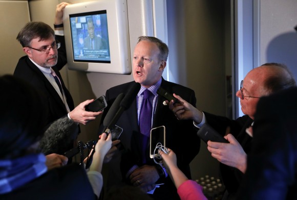 White House press secretary Sean Spicer speaks to reporters on Air Force One en route to Andrews Air Force Base from Philadelphia on Jan. 26, 2017. Spicer says that taxing imports from Mexico would generate $10 billions a year and "easily pay for the wall." (AP Photo/Pablo Martinez Monsivais)